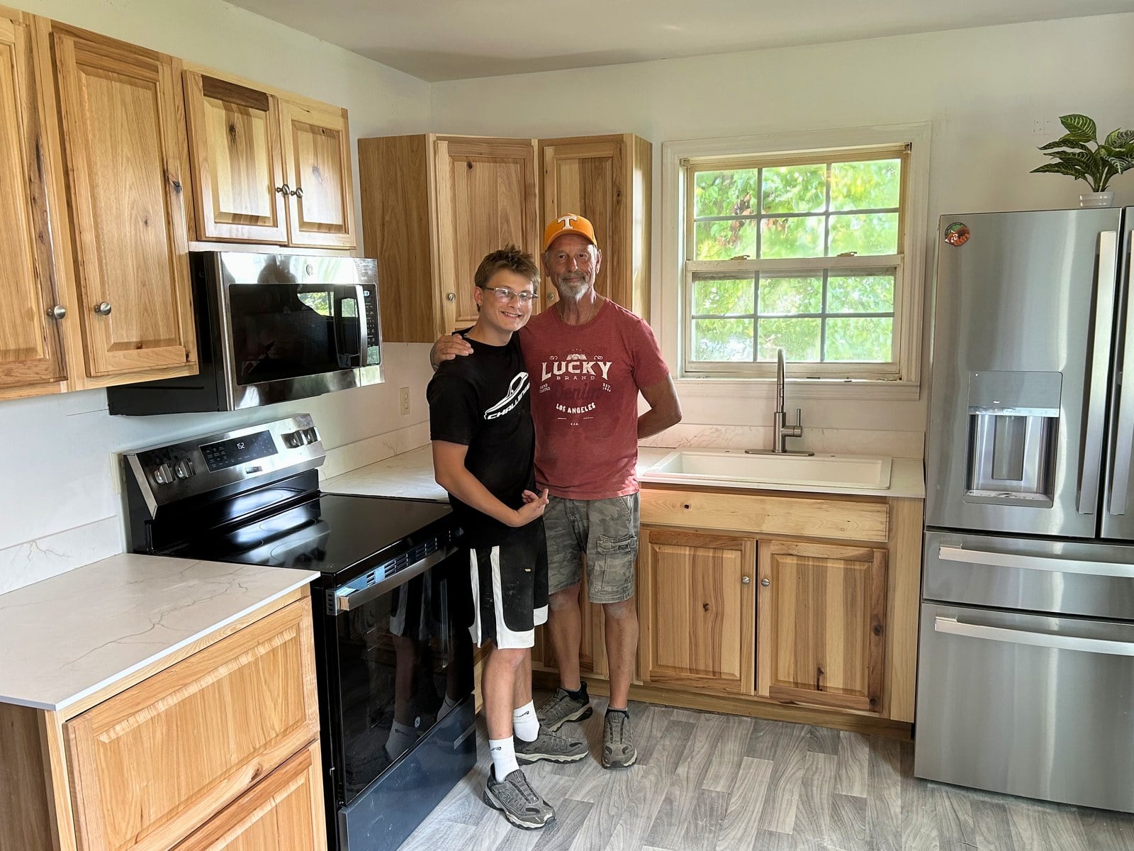 Brian and Tyler, founders of Bluerock Remodeling, in a finished kitchen