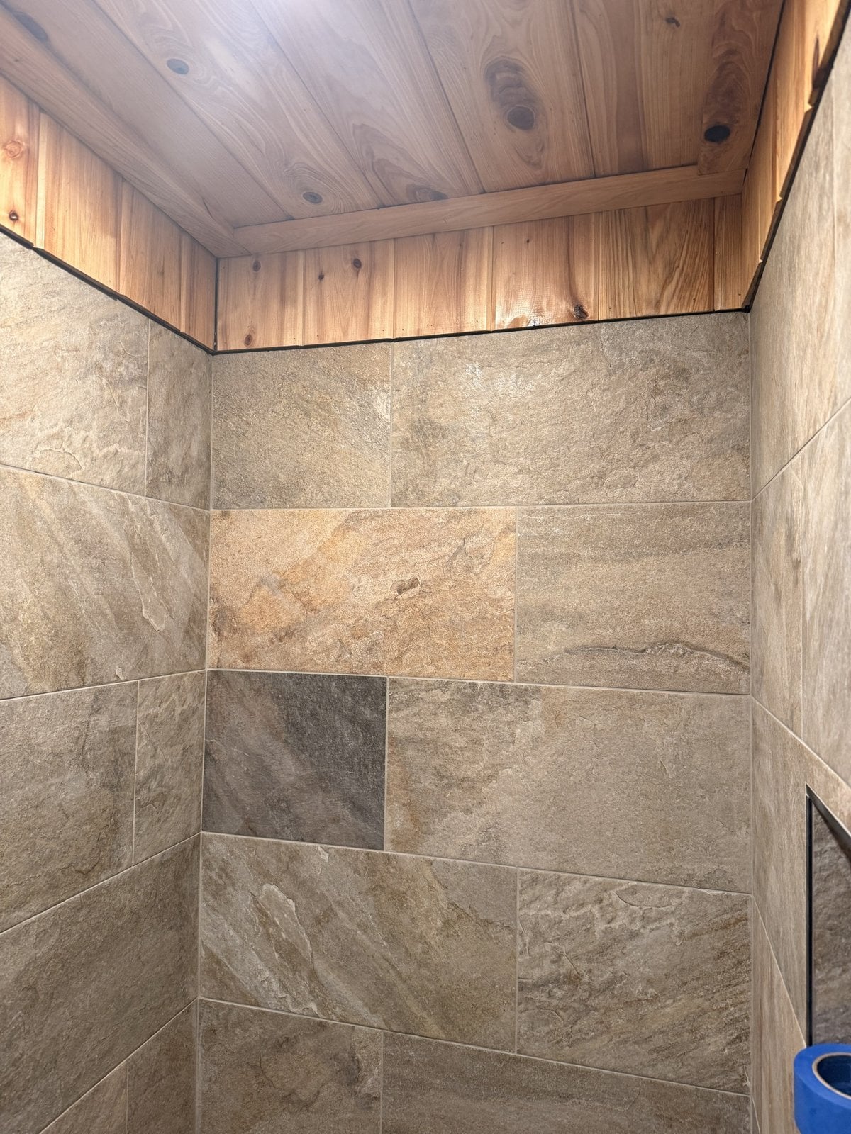 Finished walk-in shower with slate-look tile walls and cedar-plank ceiling, Manchester TN