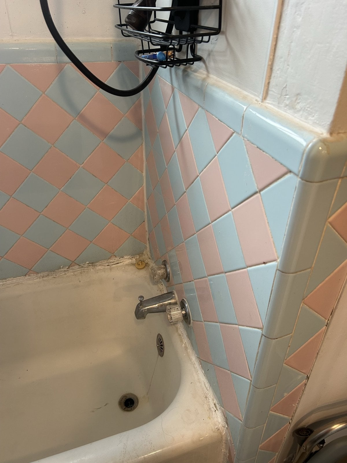 Dated pink and blue diamond-tile tub and shower before remodel, Manchester TN