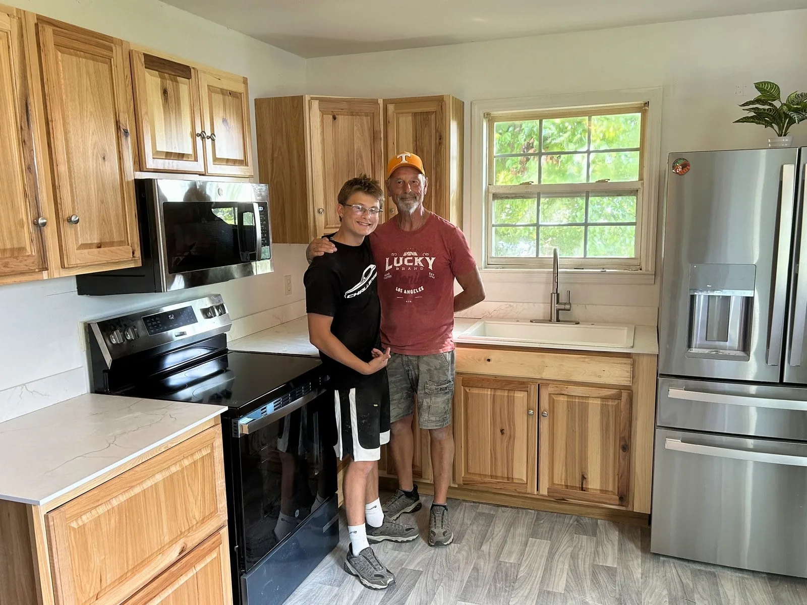 Brian and Tyler, founders of Bluerock Remodeling, in a finished kitchen